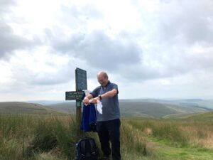 Claude wringing out vest. It must have been warm! - Lesley Parkinson
